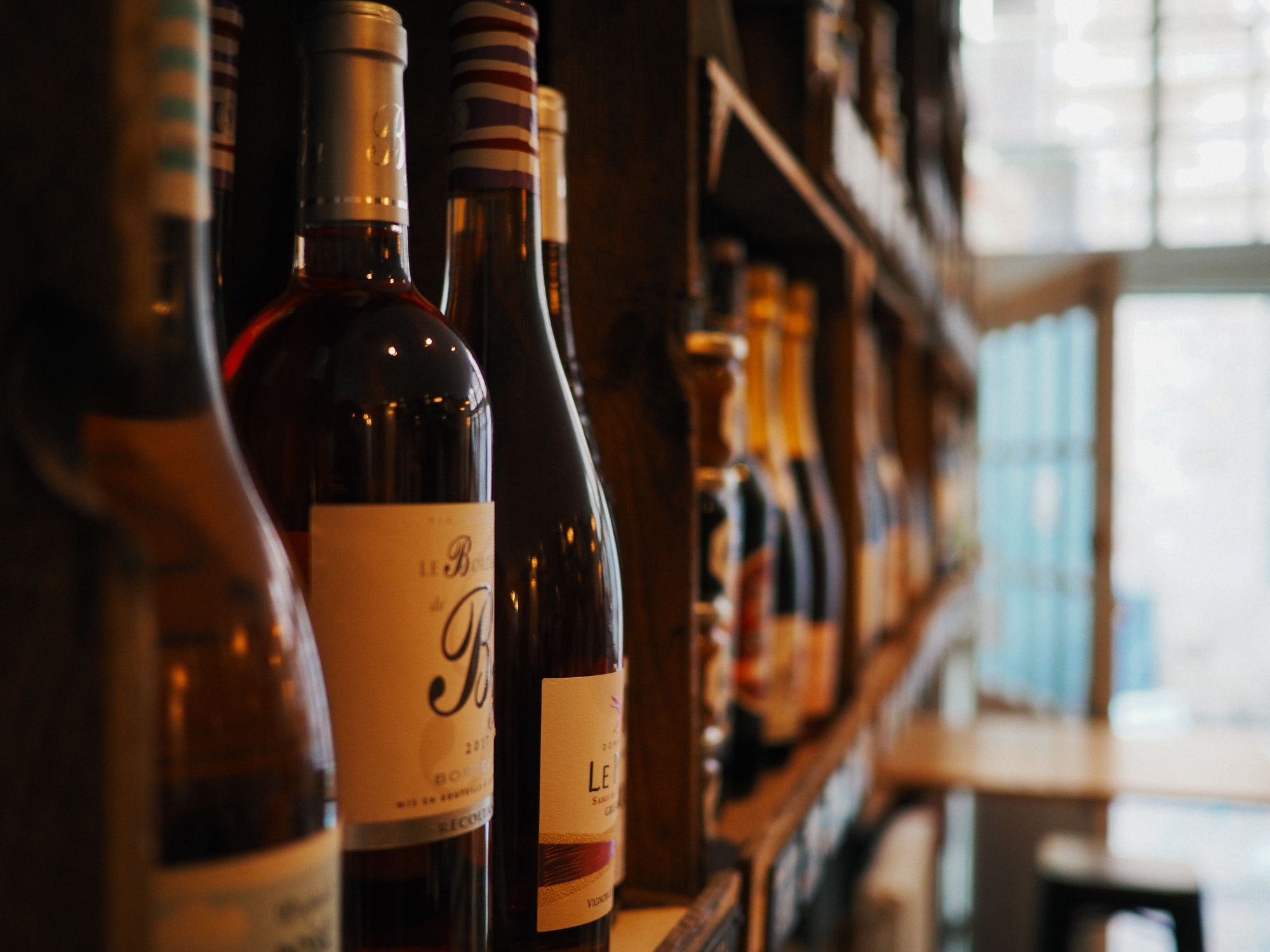 A wine fridge with a locking stainless steel door and compressor cooling technology